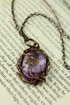 Purple Filigree Necklace As A Gift, Antique Purple Jewelry With Intricate Design, Ornate Purple Engraved Jewelry, Ornate Engraved Purple Jewelry, Handmade Purple Fantasy Necklaces, Mystical Handmade Purple Necklace, Antique Purple Metal Jewelry, Purple Amethyst Fantasy Jewelry, Purple Fantasy Pendant