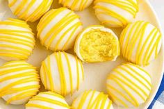 some yellow and white striped cookies on a plate