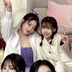 three young women posing for a photo together