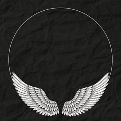 an image of two white wings in a circle on black paper with space for text