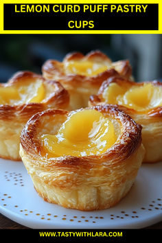 lemon curd puff pastry cups on a white plate with the words lemon curd puff pastry cups