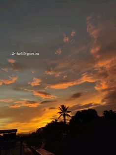 the sun is setting and there are clouds in the sky with words written on it