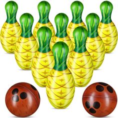 a group of bowling balls with green and yellow designs