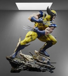 the wolverine statue is posed on top of a rock