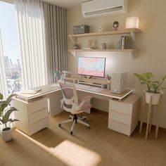 a desk with a computer on it in front of a window and a potted plant