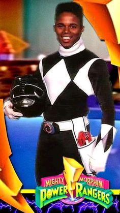 a man in a black and white suit holding a baseball glove