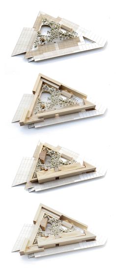 three pieces of wood are stacked on top of each other in the shape of triangulars