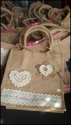 burlap bags with lace and hearts on them