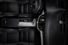 the interior of a car with black leather