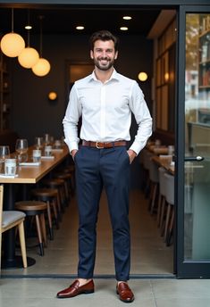 Elevate your wardrobe with this timeless smart casual look: a crisp white dress shirt ($40), navy trousers ($60), and brown loafers ($75)—affordable basics crafted for quality and style under $100.  Perfect for the modern man in 2025.  Save this pin, share your favorite wardrobe staple in the comments, and unlock the secrets of quality essentials!  #AffordableBasics #QualityEssentials #WardrobeStaples #MensFashion2025 #SmartCasual #BudgetFashion #ElevatedBasics #MensStyle2025 #AffordableMenswear #MidRangeFashion #SpringMensStyle #SustainableMenswear #CasualOutfits #StyleOnABudget #ModernMenswear Smart Casual For Wedding Men, Men’s Smart Casual Work, Smart Casual Work Men Outfit, Office Smart Casual Mens, Blue Pants Business Casual Men, Business Smart Casual Man, Investment Banker Outfit Men, Smart Casual Office Men, Smart Business Casual Men