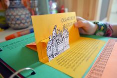 an open book with some pictures on it