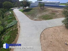 an aerial view of a paved road near the ocean