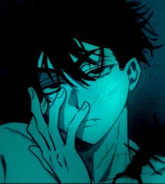 a man with his hand on his face