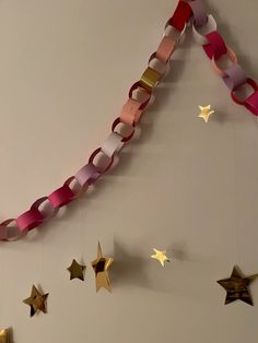 some paper stars are hanging on the wall