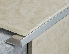 a close up view of a drawer with a metal handle on it's side