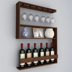 there is a wine rack with bottles and glasses on the wall next to a vase