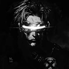 a black and white photo of a man with glowing eyes