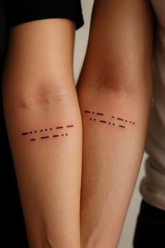 two people standing next to each other with lines on their legs and the same line in between them