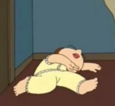 a cartoon character laying on the ground with his head down