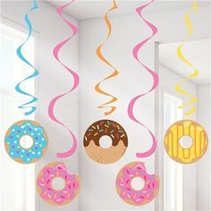 donuts hanging from the ceiling with streamers