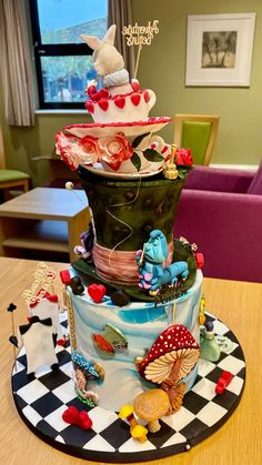 a multi - tiered cake decorated with many different things