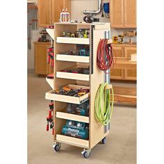 a garage storage cart with tools on it