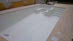 an empty swimming pool is being built