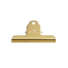a gold paper clip on a white background