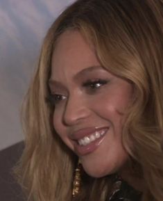 a close up of a person with long hair