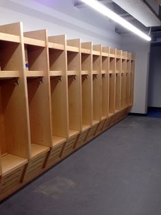 a row of wooden lockers in an empty room