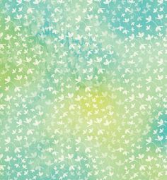 a green and blue background with small white flowers