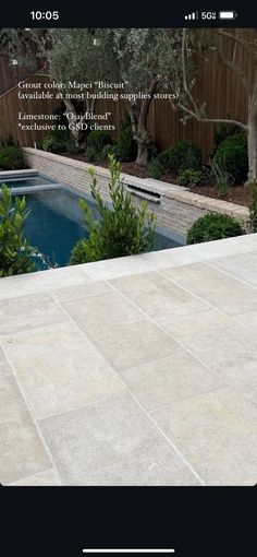 an image of a backyard with a pool in the middle and landscaping around it that is designed to look like stone