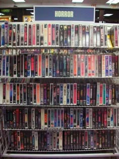 the shelves are filled with many different video game consoles