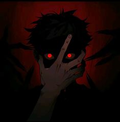 a man with red eyes holding his hand up to his face