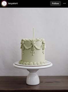 a white cake sitting on top of a wooden table