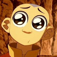 a cartoon character with big eyes looking at the camera while standing in front of a rock formation