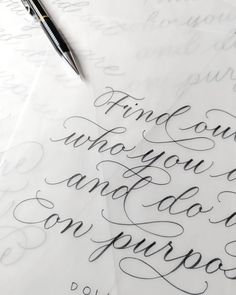 some writing on top of paper with a pen