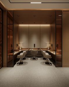 an office with two desks and chairs in front of a wall full of wine bottles