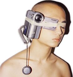 a man with an eye patch on his forehead and a camera attached to his head