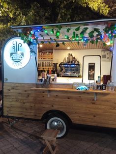 the food truck is decorated with christmas lights