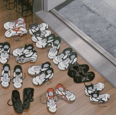 there are many pairs of shoes on the floor