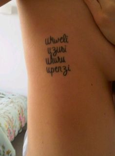 a woman with a tattoo on her back saying, what we want when we open it