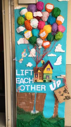 a door decorated with colorful balloons and paper machs that say lift each other up