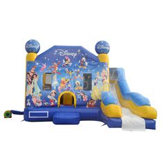 an inflatable bounce castle with slide and slides