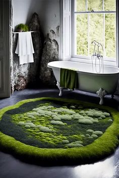 a bath tub sitting in a bathroom next to a green rug on top of a floor