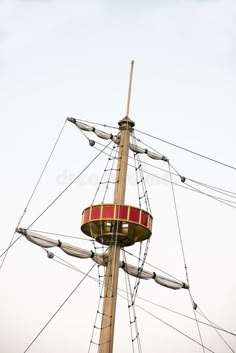 the top of an old fashioned pirate ship mast with ropes and sails royalty images, stock photos