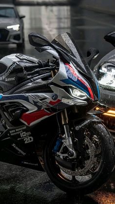 two motorcycles parked next to each other on the street