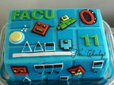 a cake that is shaped to look like a video game console with the words facu on it