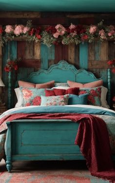 a bed with flowers on the headboard and foot board in front of a wooden paneled wall