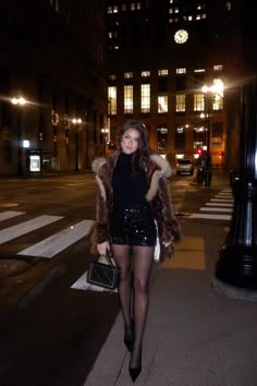 sequin mini skirt | black sequin mini skirt | black mini skirt | Black paten leather heels | black closed toe heels outfit | fur coat | short brown fur coat | short fur coat | fur coat outfit | date night outfit | Holiday outfit | new years eve outfit inspo | christmas outfit inspo | christmas eve outfit inspo | chanel purse | black chanel purse with silver hardwear | black sheer tights outfit | blowout hair style | Hair cut inspo | downtown at night photos | outfit photos at night | nighttime city photos | picture inspo | pose examples | blac heels tights and mini skirt outfit | chicago | winter outfit inspo | going out outfit inspo | girls night outfit inspo | skirt winter outfit | tights | tights outfit | tights and skirt outfit | black sheer tights outfit | black tights outfit Winter Sequin Skirt Outfit, Sequin Skirt Black Tights, Sparkly Skirt Outfit Winter, 2024 Nye Outfit, Nye Outfit Cold Weather, Vegas Outfit Inspo Winter, 2024 New Years Outfit, Sequin Nye Outfit, Skirt With Sheer Tights